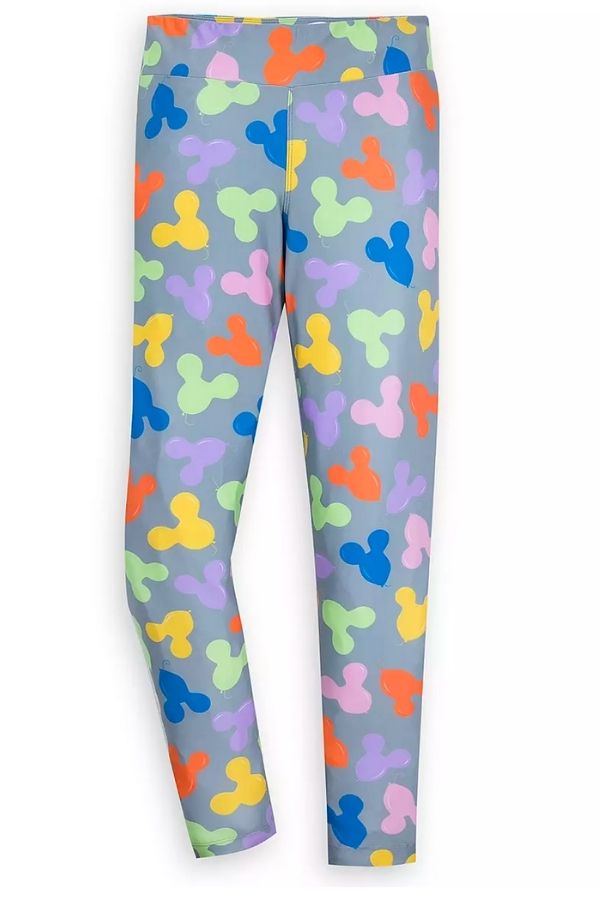 a gray pair of leggings with pastel colored Mickey Ears balloons printed on them.