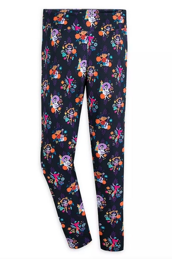 A black pair of leggings featuring characters from Disney and Pixar's feature film, Coco. 