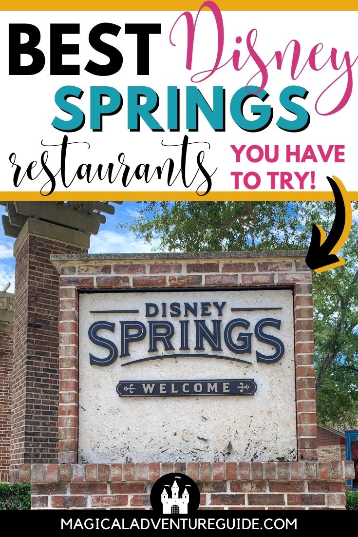 brick sign reading, "Disney Springs- Welcome" 