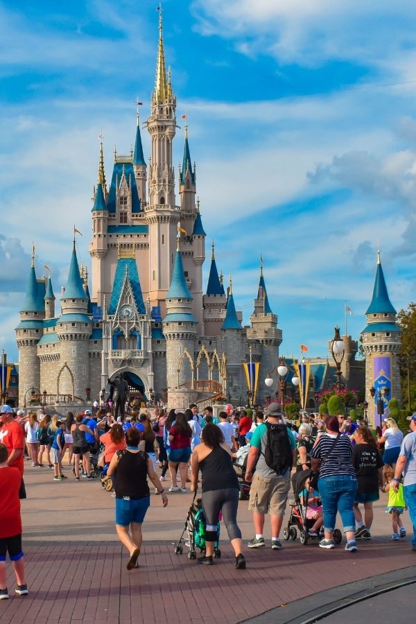 people walking at Disney World in front of Cinderella's Castle at the Magic Kingdom
