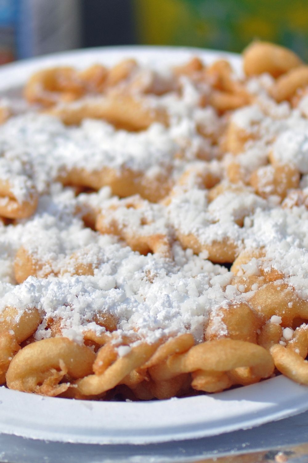 funnel cake on a paper plate at disney world