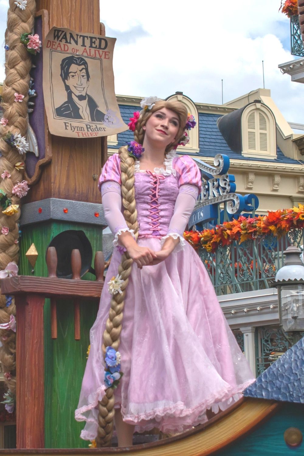 Rapunzel, the Princess from the movie Tangled, poses for the crowd at Walt Disney World