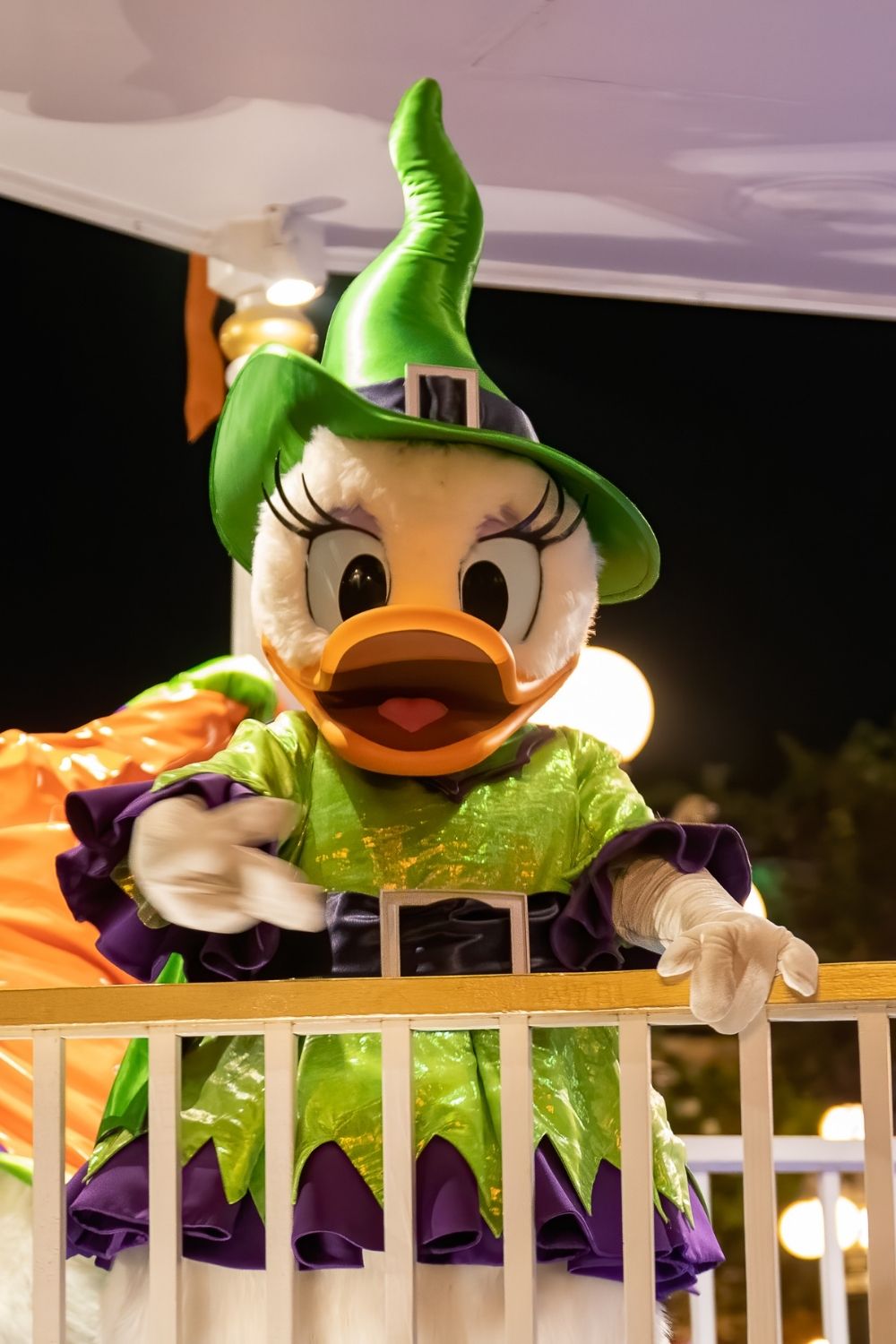 Daisy Duck in a Halloween-themed costume during a parade at Disney World