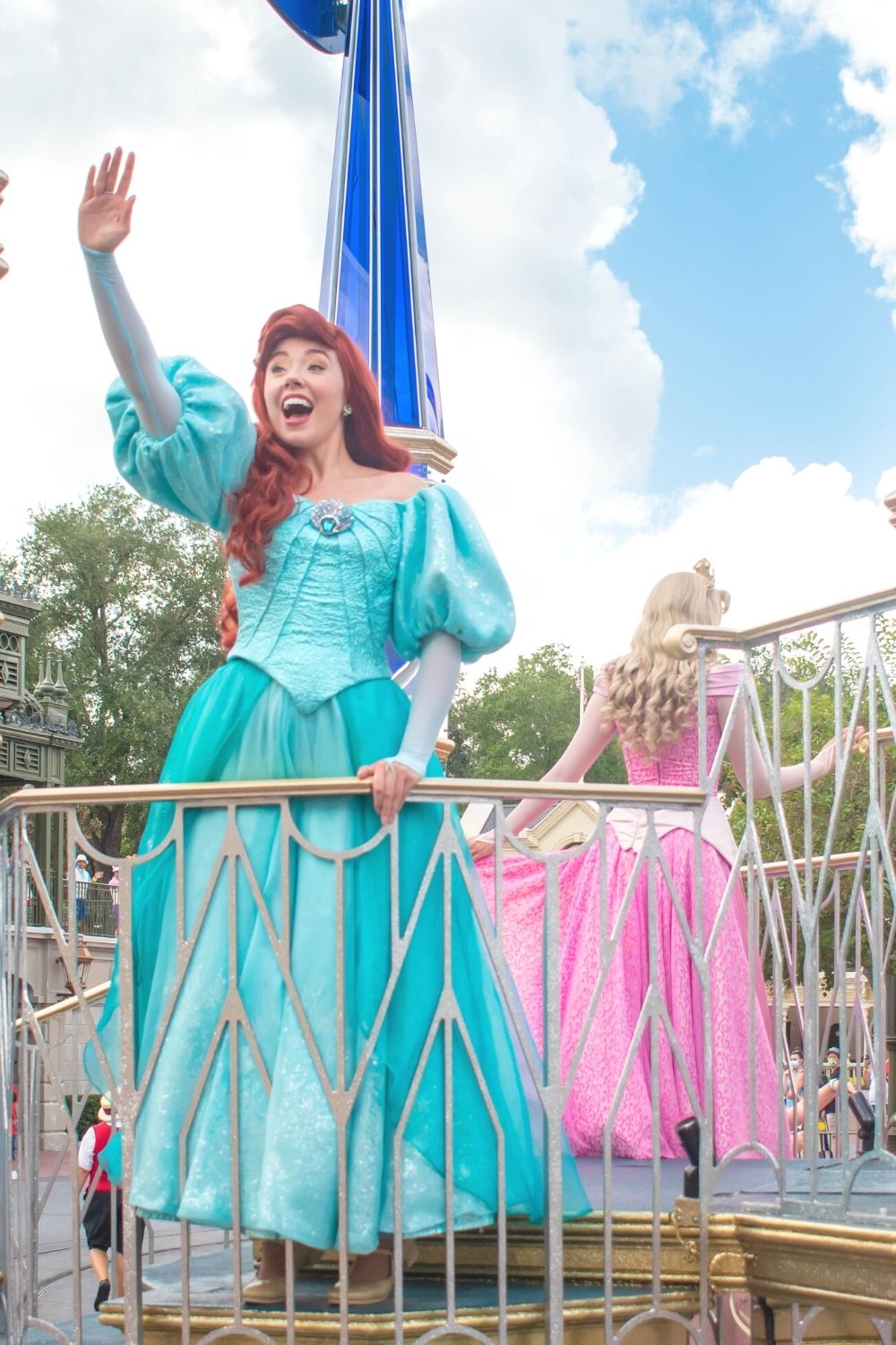 Ariel and Aurora on a float at Disney World in the parade