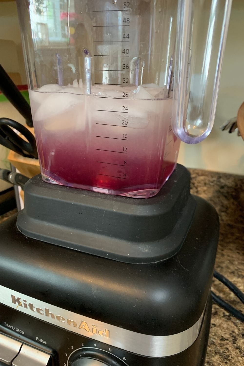 lemon juice, water, ice, and violet syrup added to blender jar prior to blending