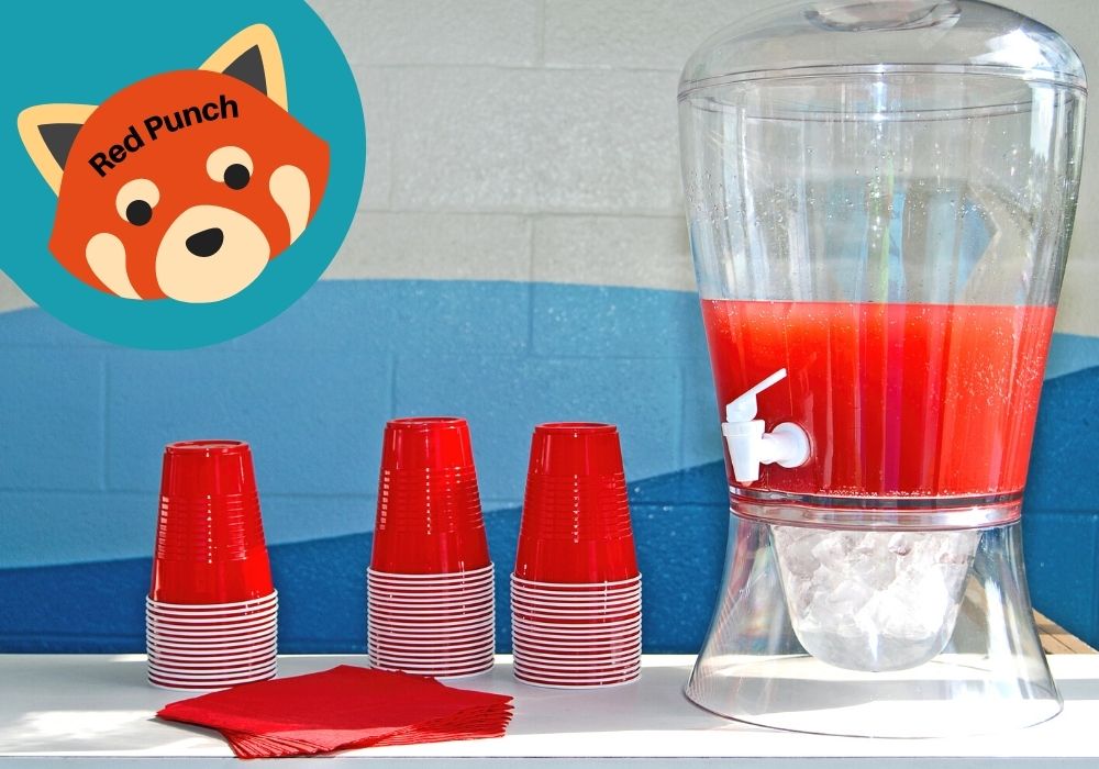 a carafe of red punch with red solo cups next to it for a Turning Red birthday party. A red panda icon reads "red punch"