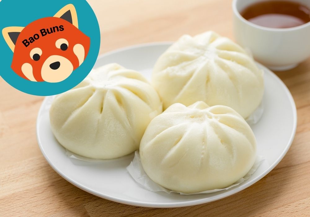 three bao buns on a white plate with a small cup of dipping sauce in the background. A red panda icon reads "bao buns"