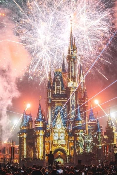 cinderella's castle at night, with fireworks and laser light show