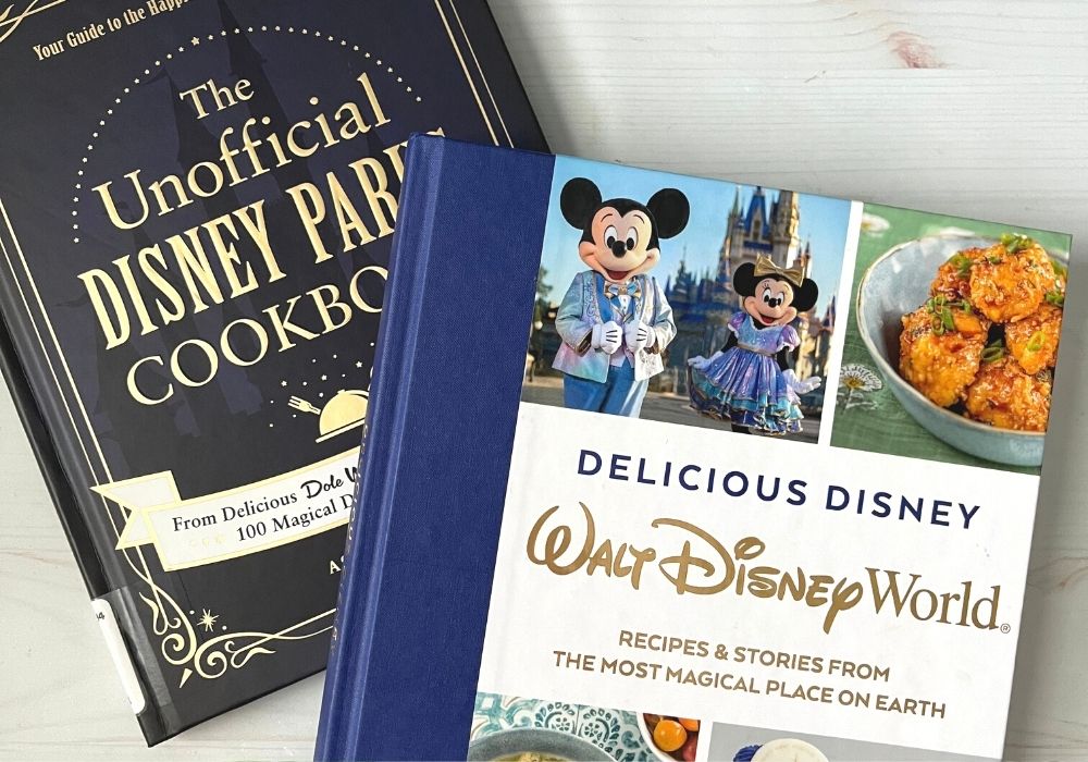 two Disney cookbooks, including "The Unofficial Disney Parks Cookbook" and "Delicious Disney: Walt Disney World Recipes and Stories from the Most Magical Place on Earth"
