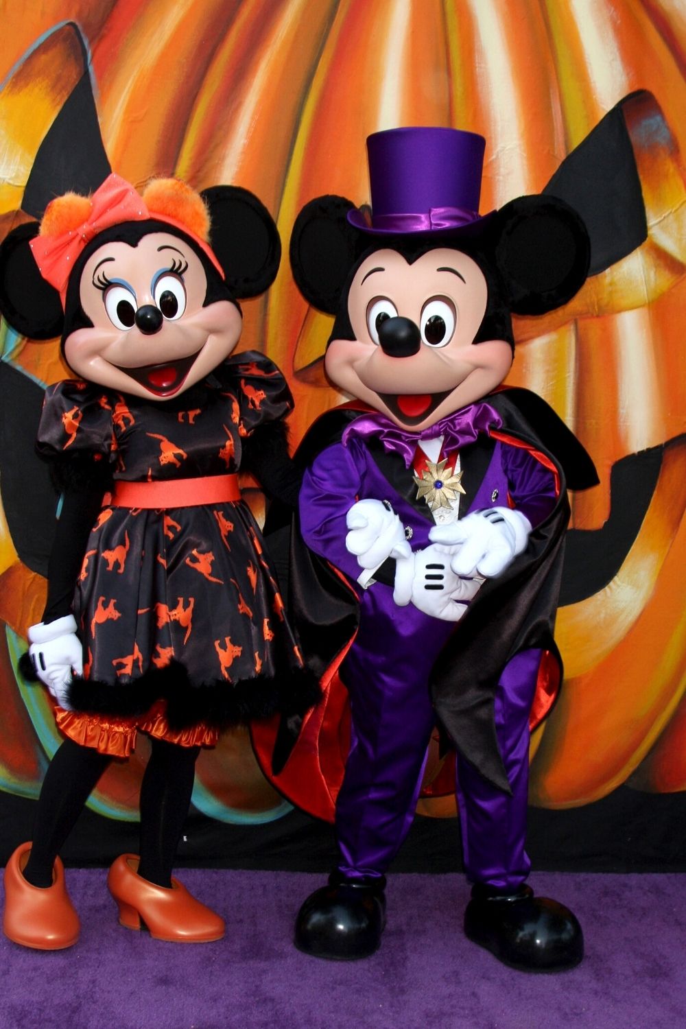 Mickey and Minnie Mouse in Halloween attire at Disney World