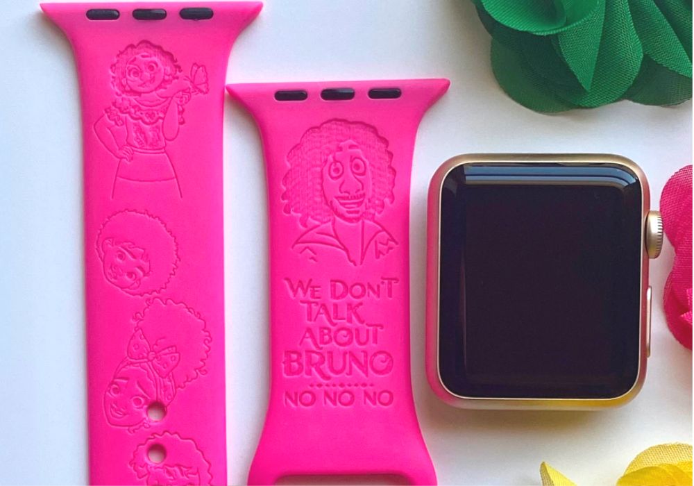 pink Encanto watch band engraved with various movie characters