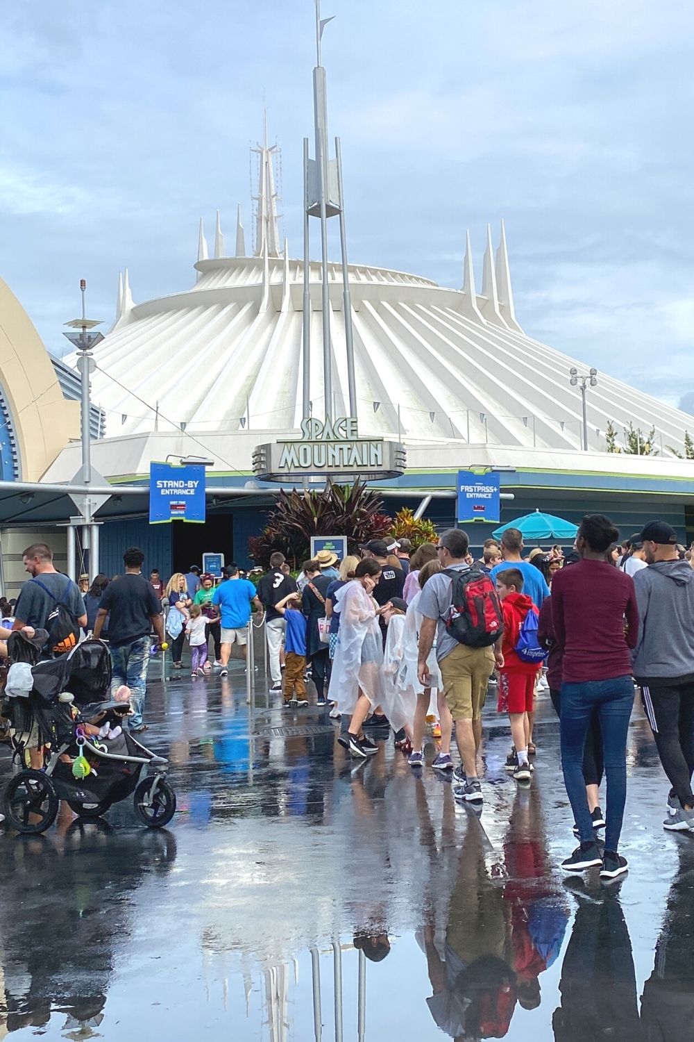 guests wait in the queue for Space Mountain at Magic Kingdom in Disney World