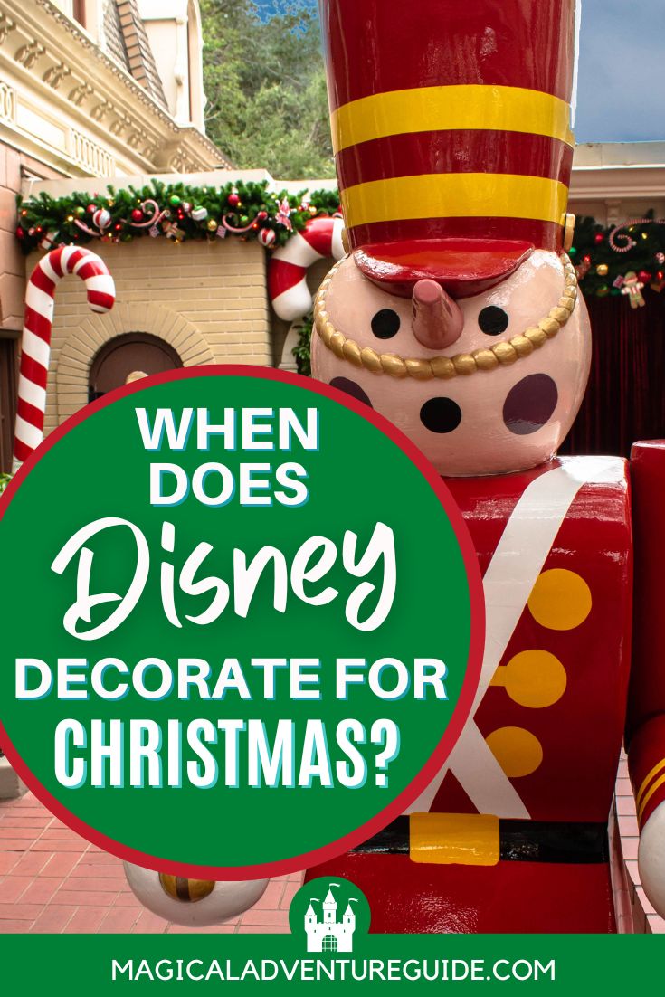 a wooden Christmas soldier set up at Disney World. An overlay reads, "When does Disney decorate for Christmas?"