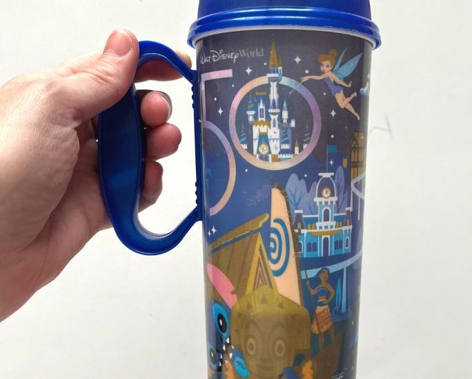 a Disney Resort refillable mug featuring the 50th anniversary design