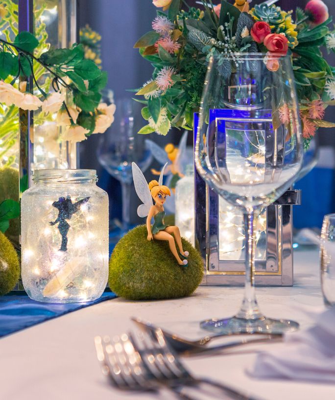 disney-themed wedding tablescape including tinkerbell