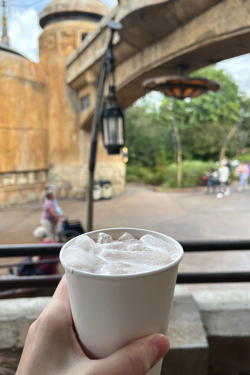 tatooine sunset drink in a woman's hand at ronto roasters in galaxy's edge in disney's hollywood studios