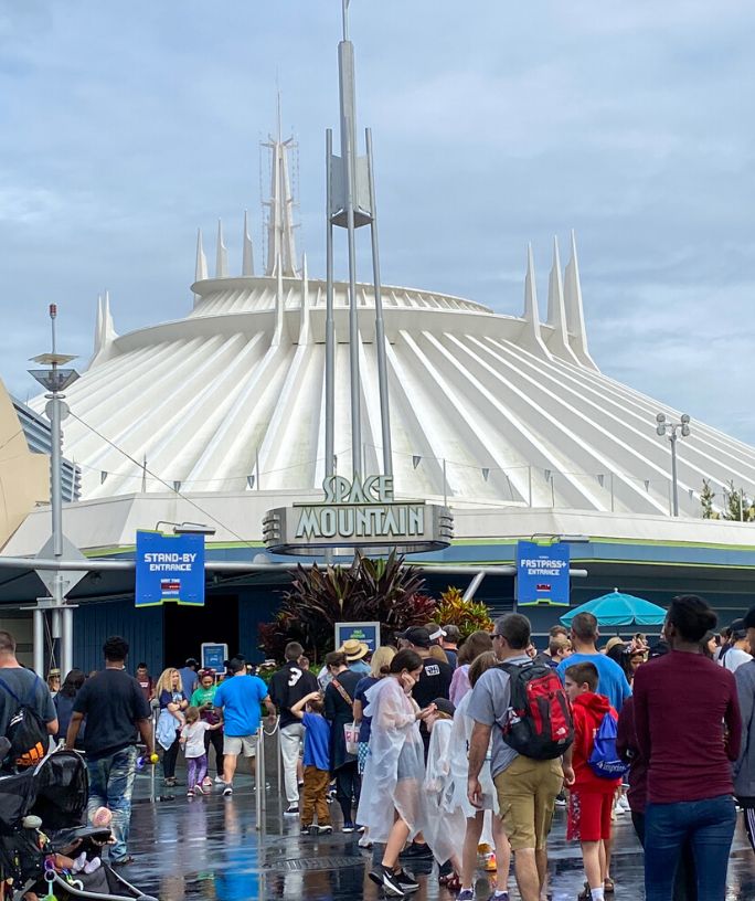 queue area outside of Space Mountain in Magic Kingdom, where guests are lined up waiting for the attraction