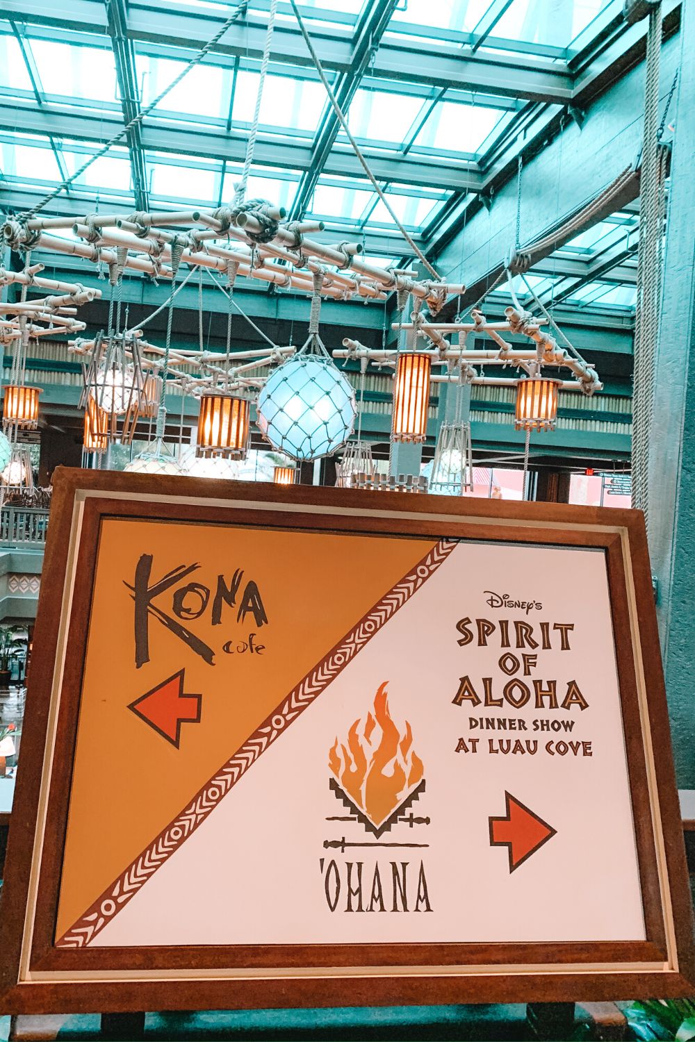 sign in Disney's Polynesian Village Resort directing guests to 'Ohana and Kona Cafe