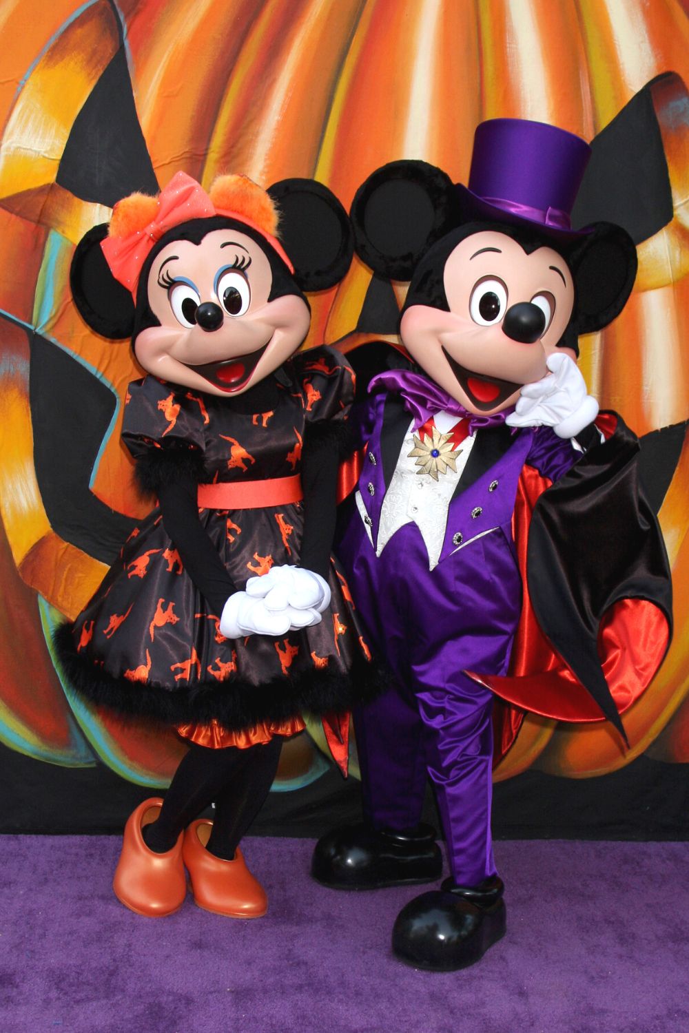 Mickey and Minnie Mouse dressed in Halloween attire at Disney World in October