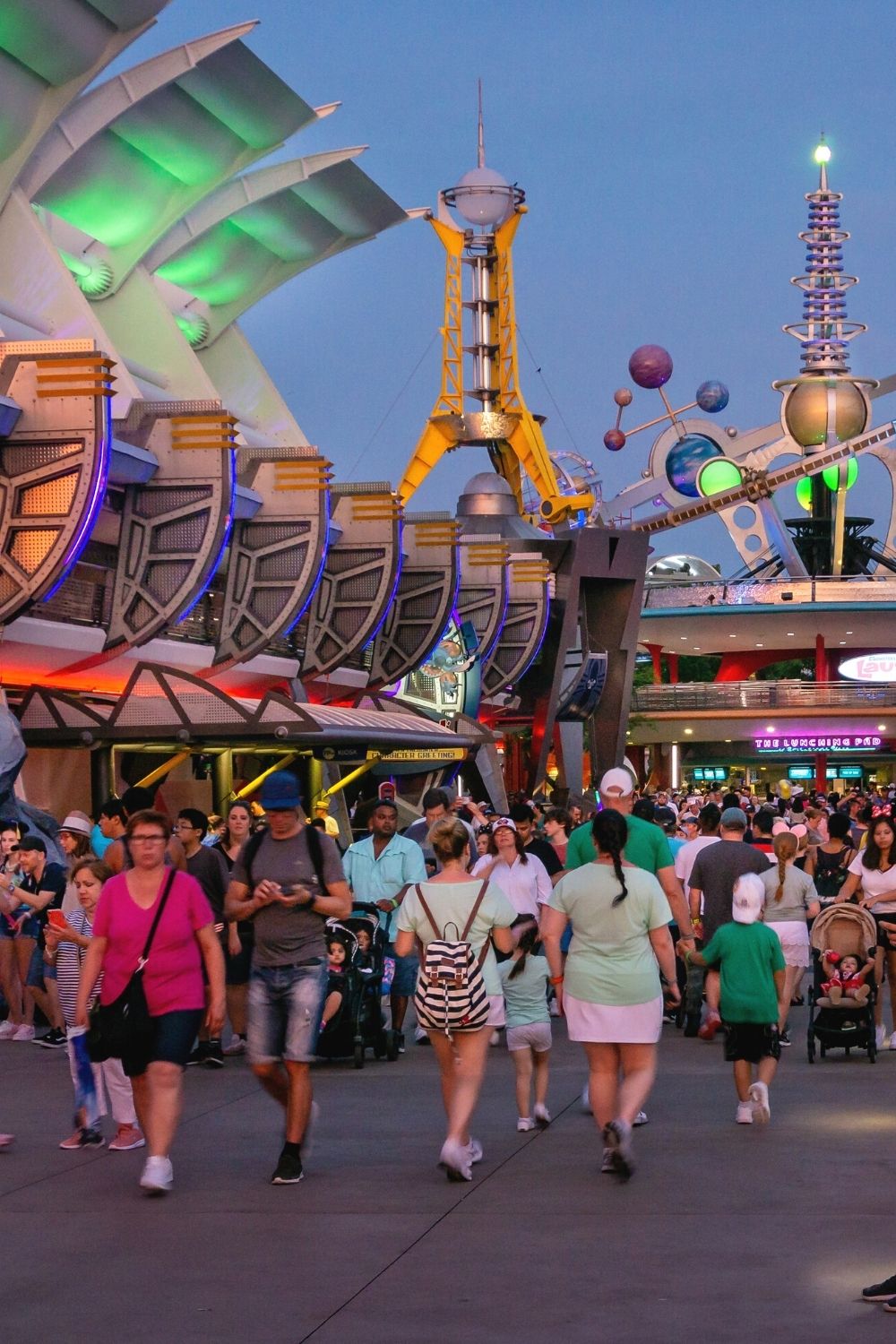 Guests walking in Tomorrowland at Disney's Magic Kingdom theme park